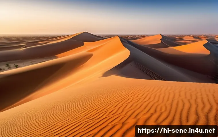 세네갈 사막 투어 - A vast Senegalese desert landscape at sunrise, showcasing diverse sand dunes in golden yellow, light...